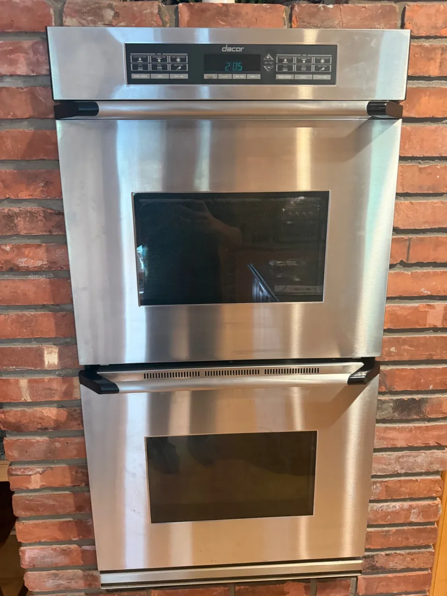 Dacor double wall oven set into a brick wall