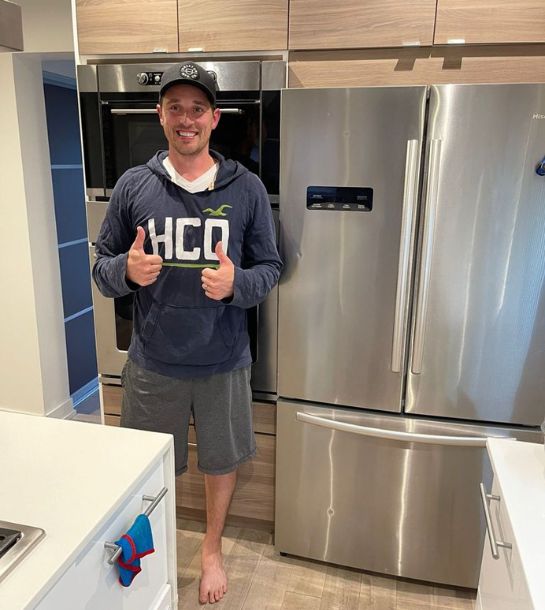 Customer happy after appliance repair by Elevate Repair