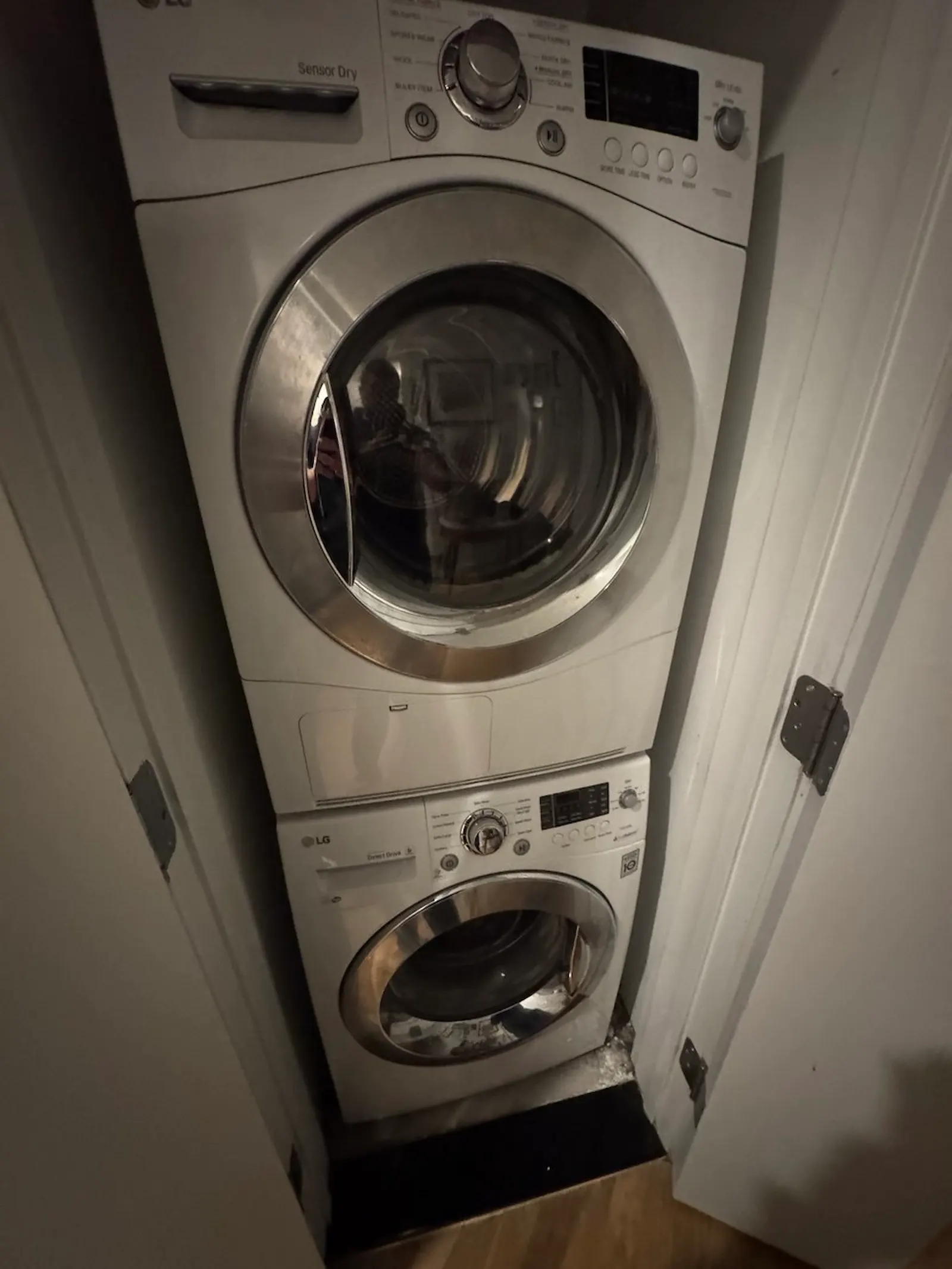 Stacked LG washer and dryer in a laundry closet
