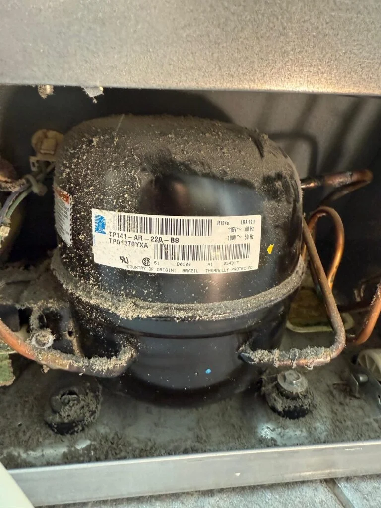 Refrigerator compressor close-up during a diagnosis